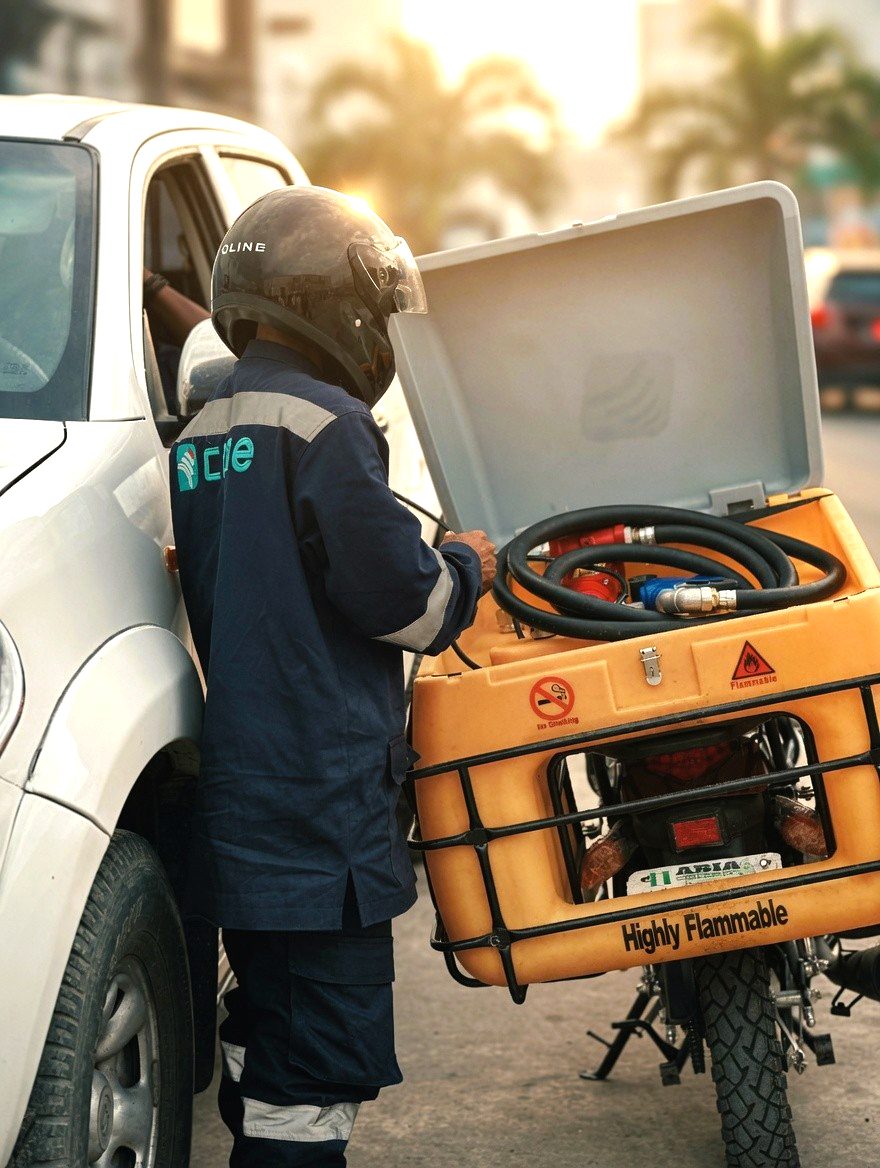 Cone Fuel rider at a residential delivery point at night
